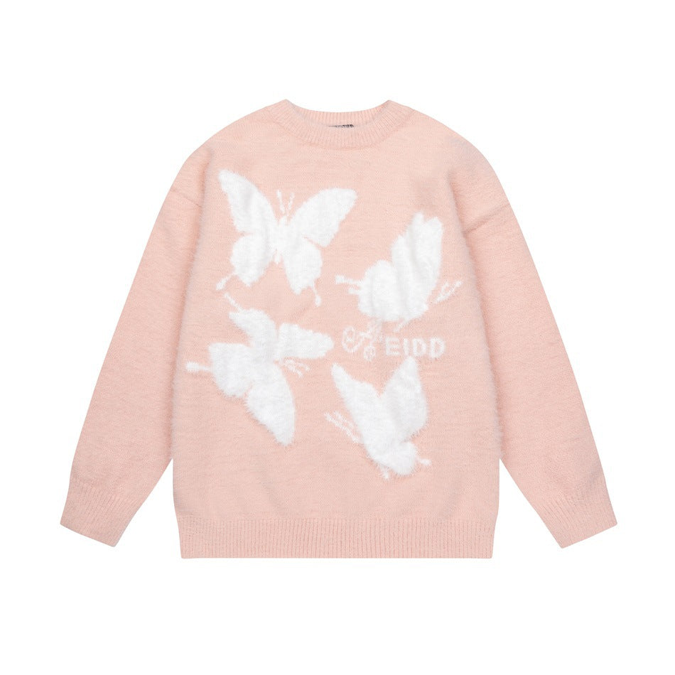Pink crew-neck knit sweater flat lay with four fuzzy white butterflies on the front