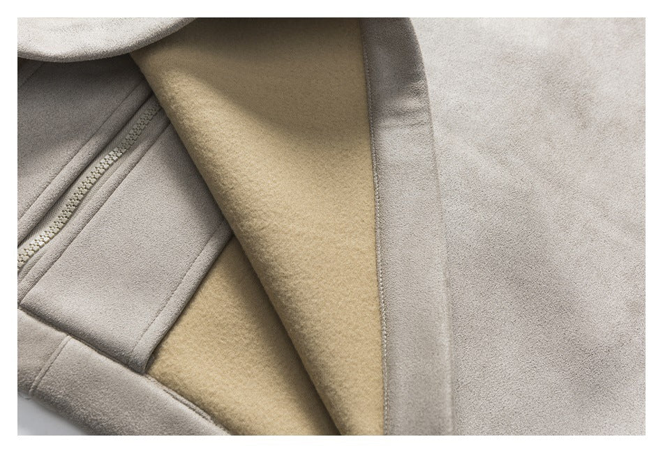 Close-up showing the taupe jacket zipper, edge stitching, and tan inner lining.