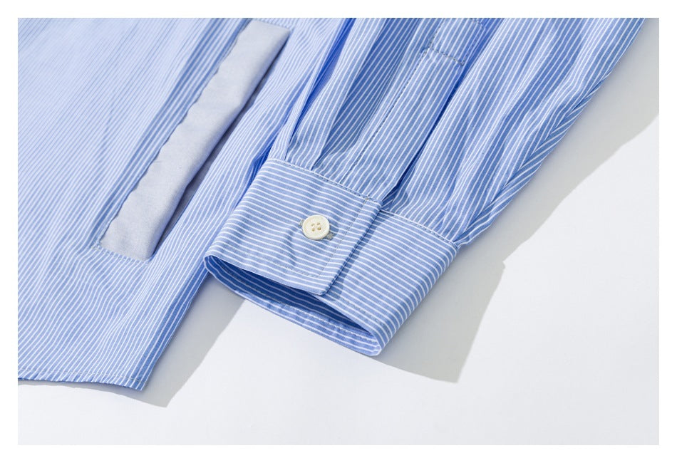 Close-up of a striped shirt sleeve cuff with a cream button and a nearby solid-blue inset.
