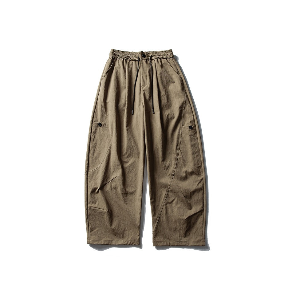 Khaki wide-leg pants flat lay, front view, with elastic drawstring waist, button and side button tabs