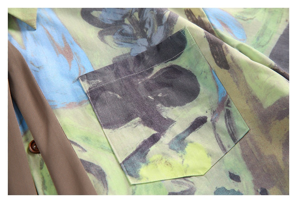 Close-up of a square chest pocket on a lime, blue, and charcoal abstract-print shirt.