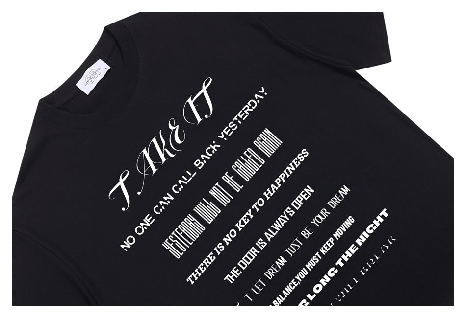 Angled close-up of a black T-shirt with a large white English text graphic.