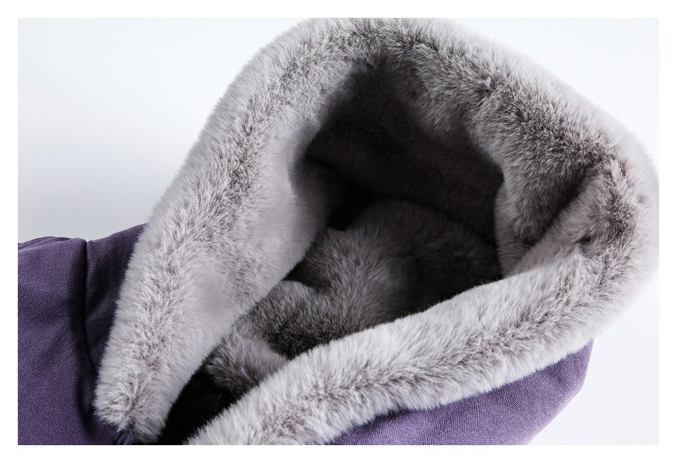 Close-up of a purple garment's hood with thick light-gray fur trim and a dark interior.