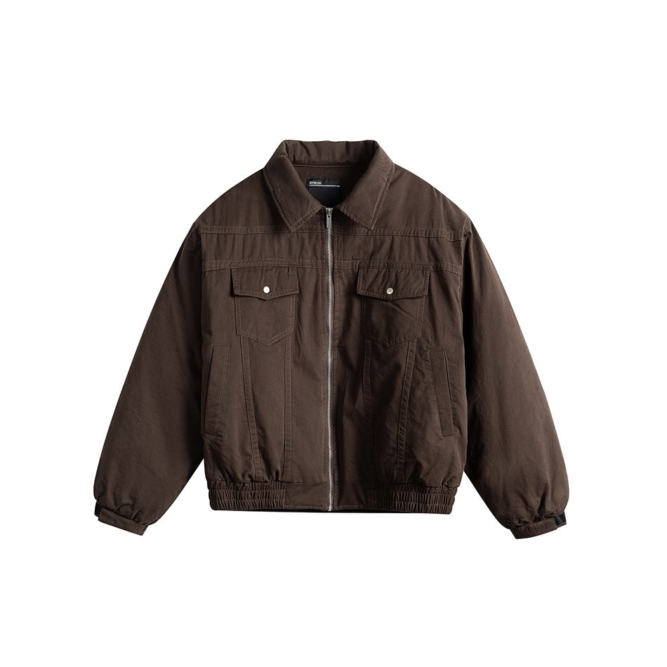 Coffee brown collared zip-front jacket with chest flap pockets and elasticized hem, flat lay front view