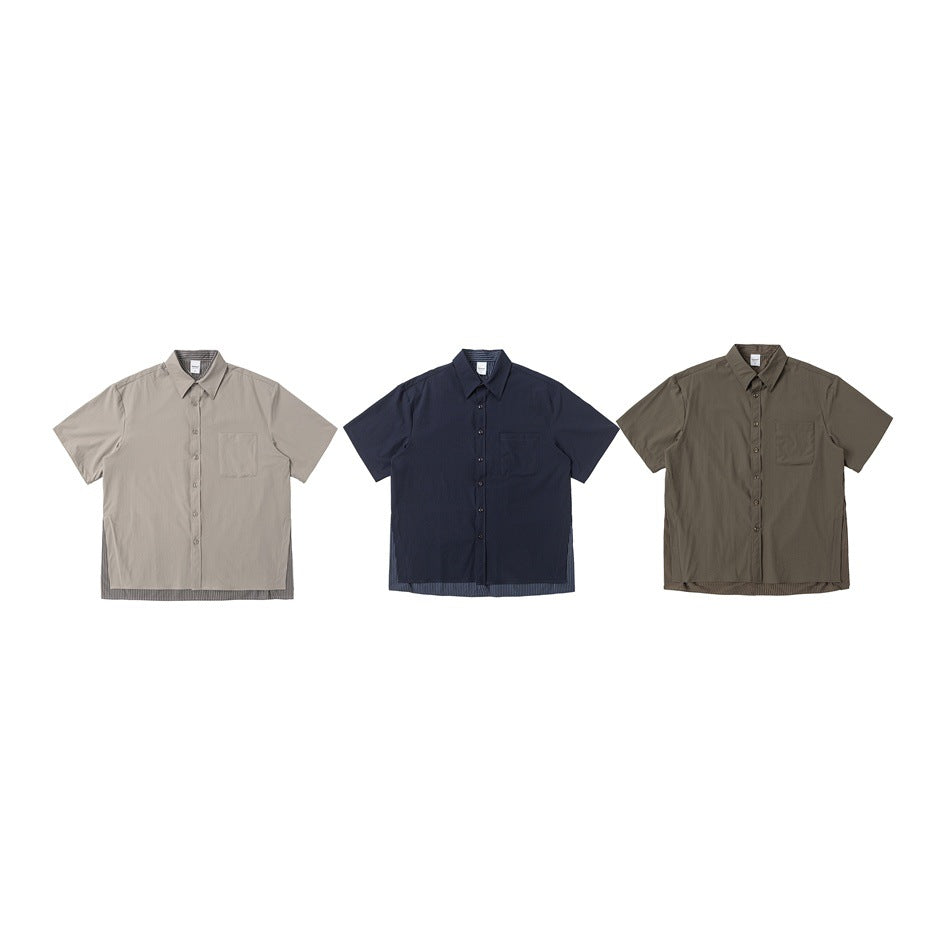 Three short-sleeve button-up shirts with chest pockets shown in light beige, navy, and olive colorways.