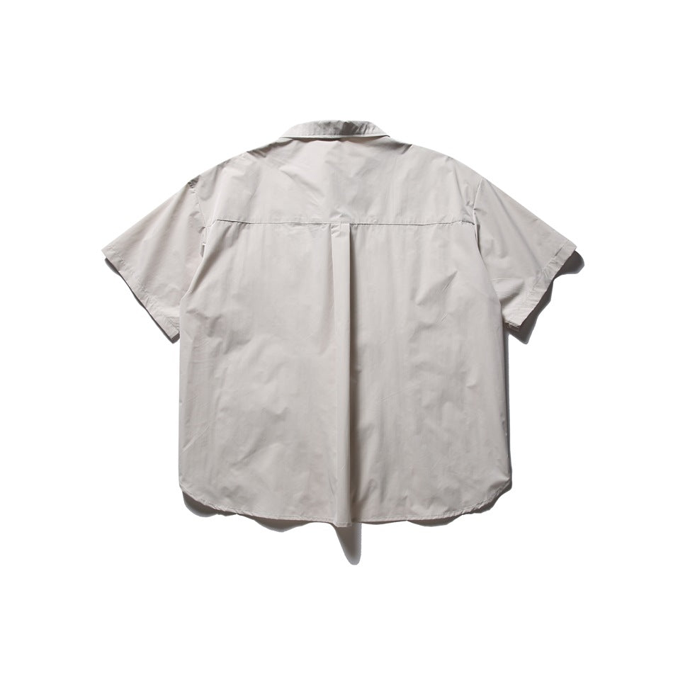 Back view of a light gray short-sleeve button-up shirt laid flat, showing a center pleat.