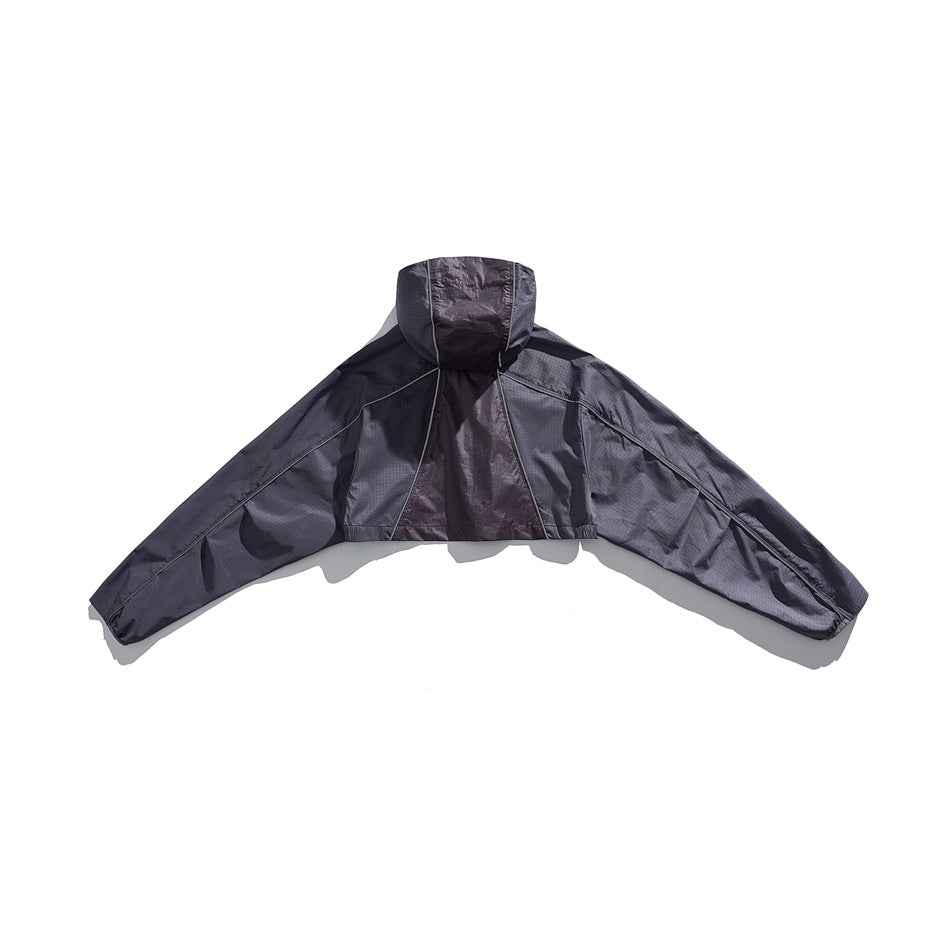 Back view of a dark charcoal hooded jacket laid flat with its long sleeves spread wide.