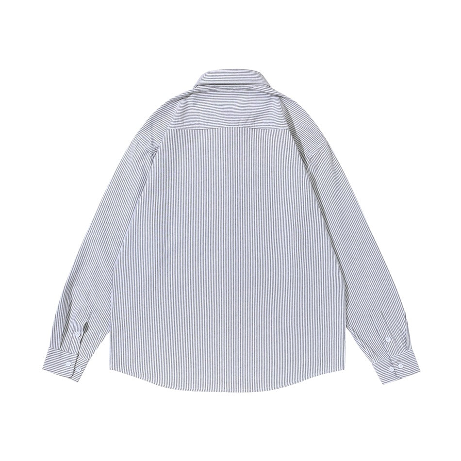 Back view of a white shirt with fine gray vertical stripes, a horizontal shoulder yoke, and long sleeves.