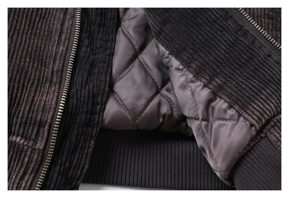 Close-up showing the jacket's quilted lining, ribbed trim, and zipper.