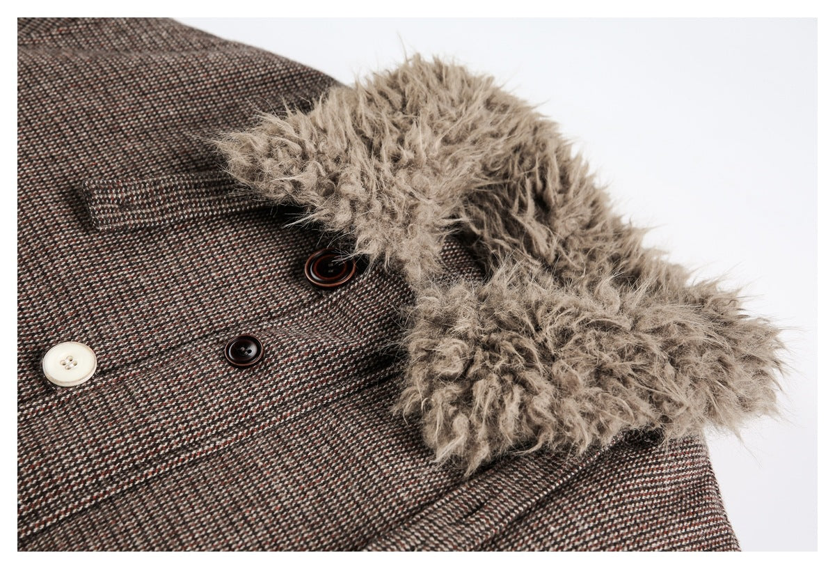 Close-up of the coat's beige faux-fur trim beside its brown patterned fabric and contrasting buttons.