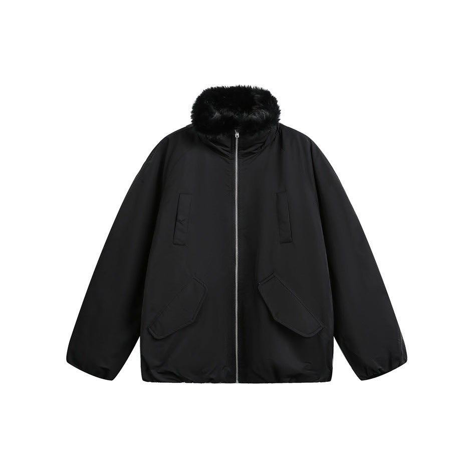 Black zip-up jacket with black fluffy collar trim, flap pockets and elastic cuffs, flat lay on white