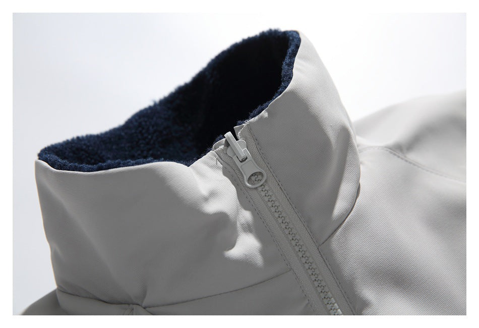 Close-up of the jacket's high collar with dark lining and front zipper.