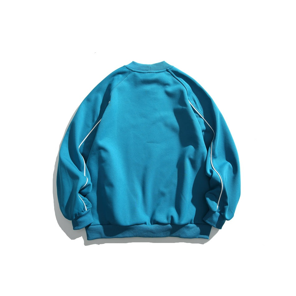 Back view of a bright teal sweatshirt with white piping along the raglan sleeves and ribbed cuffs and hem.