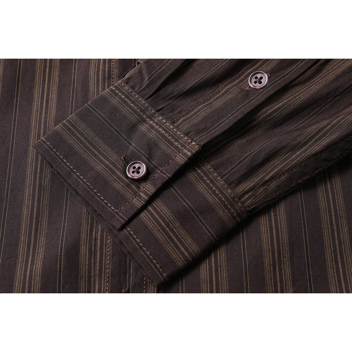 Close-up of the dark brown striped shirt sleeve, buttoned cuff, and matching buttons.