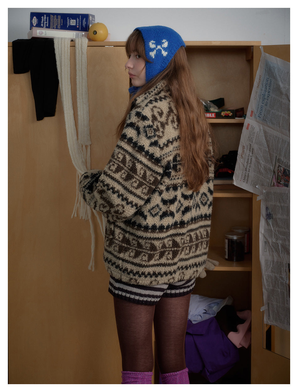 Side and back view of a model wearing a beige-and-black patterned jacket with a blue knit bonnet.