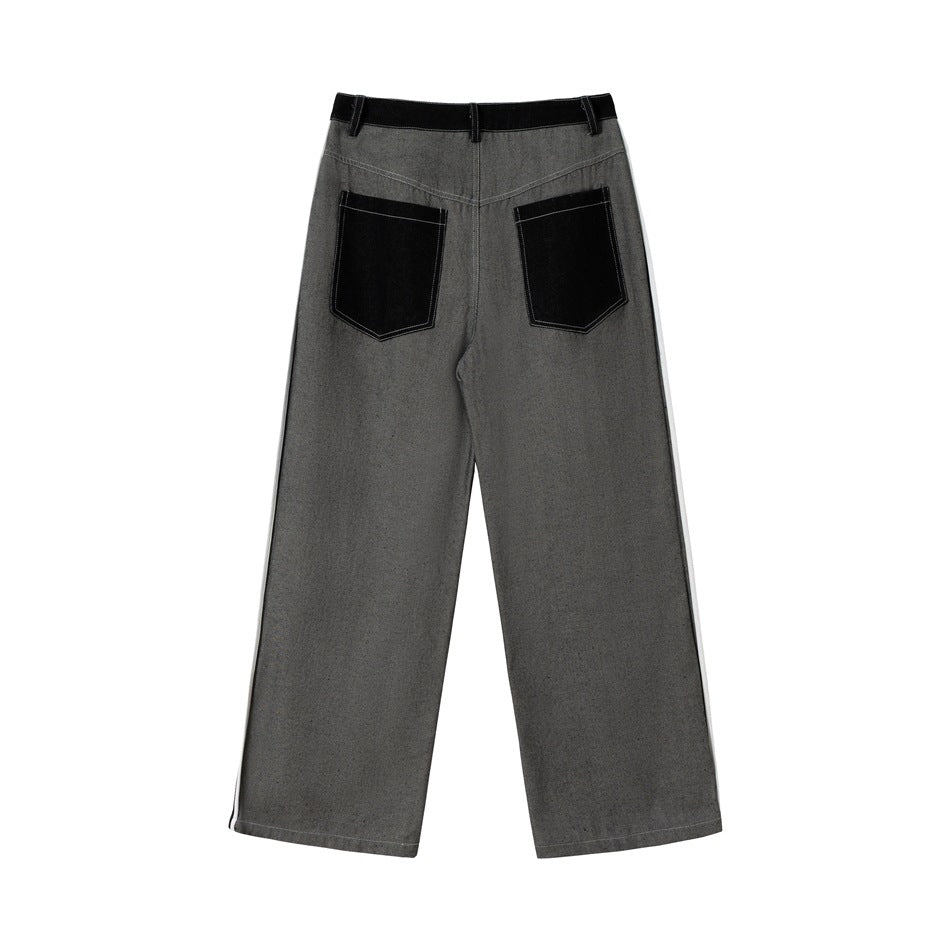 Rear view of gray wide-leg jeans with a black waistband and two large black back pockets.
