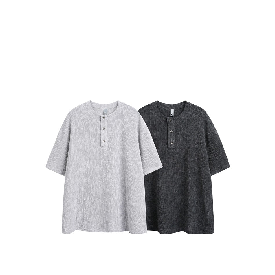 Two short-sleeve henley shirts shown flat against white, one light gray and one charcoal.