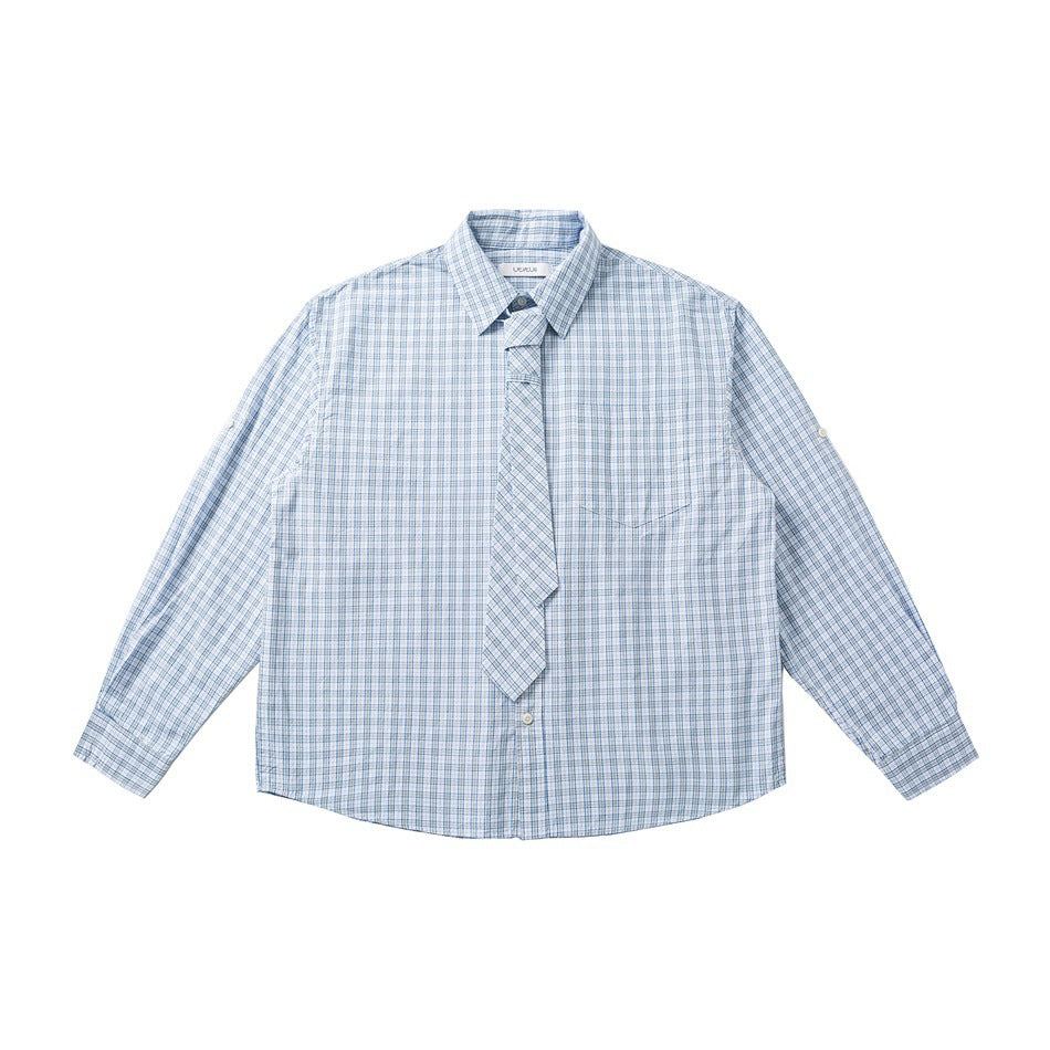 Front of light blue plaid button-up shirt with chest pocket and matching plaid tie at the collar, flat lay