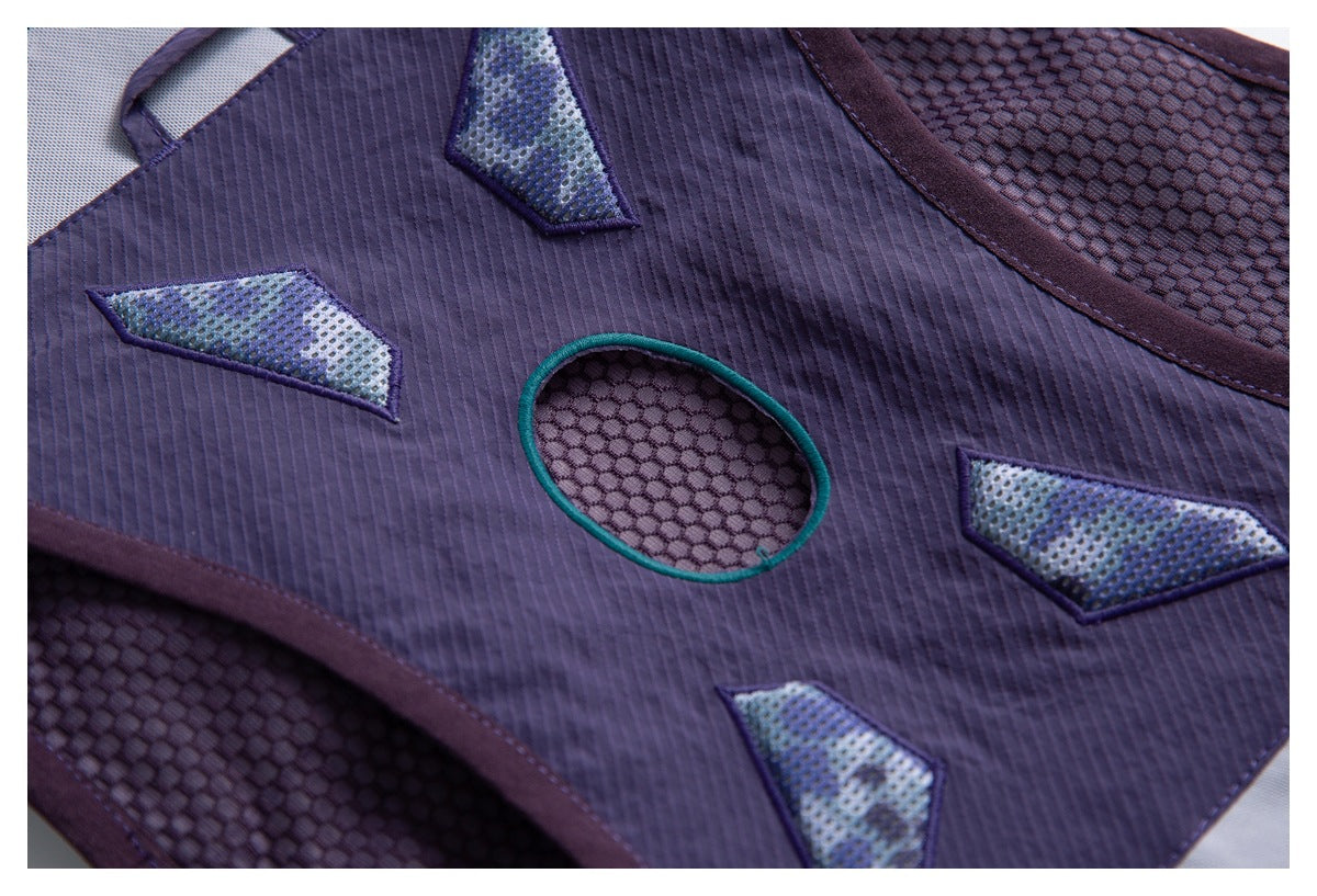 Close-up of a purple backpack panel with mesh geometric accents and a turquoise-edged oval opening.