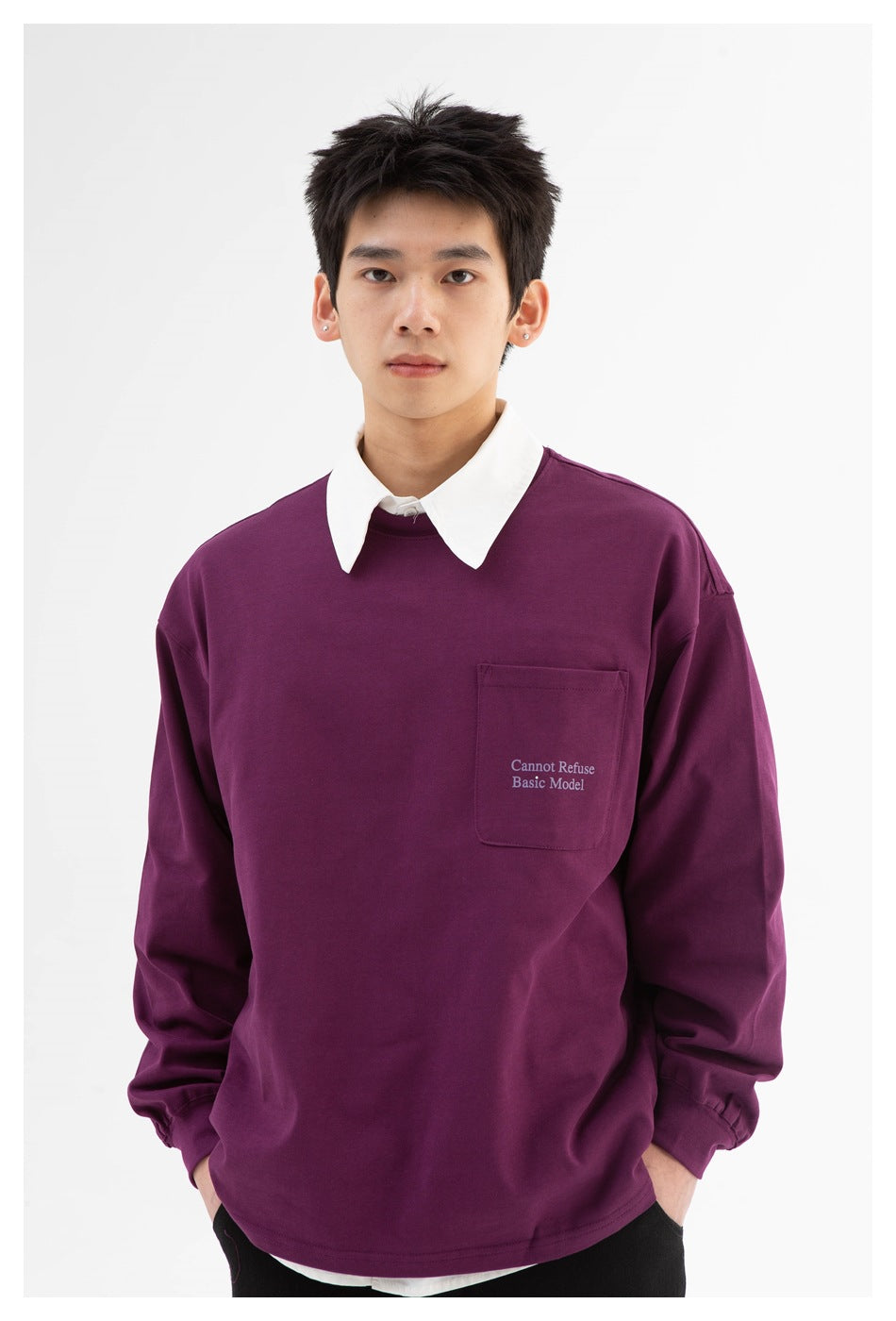 Close front view of a model wearing a plum long-sleeve shirt with a white collar and printed chest pocket.