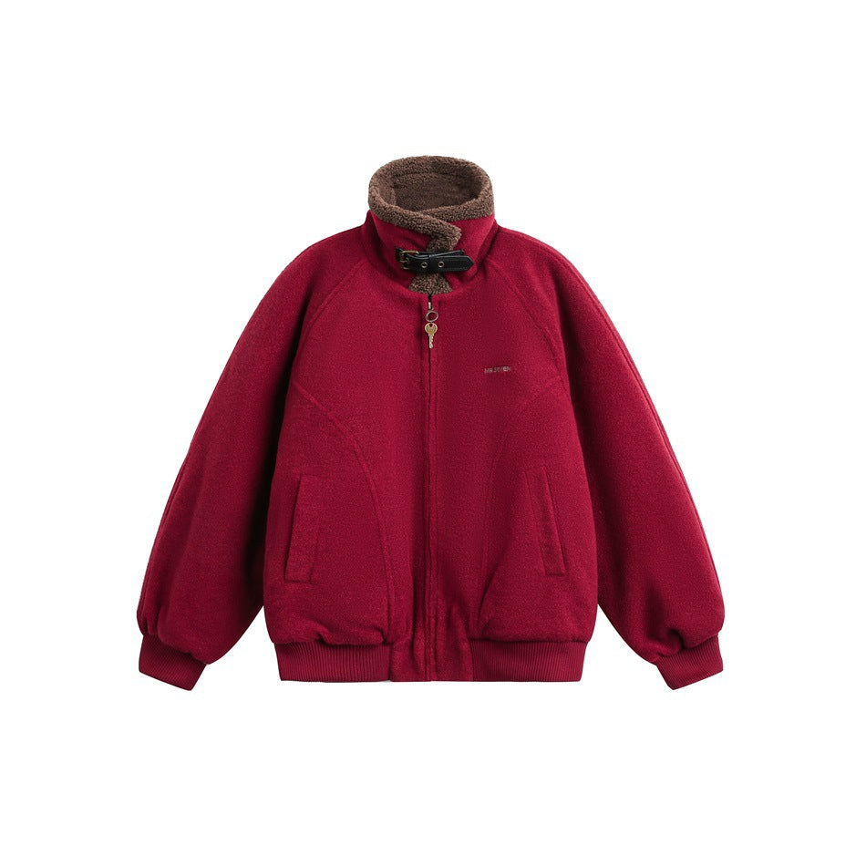 Burgundy zip jacket with brown fleece-like stand collar, black buckle strap, key zipper pull and ribbed cuffs