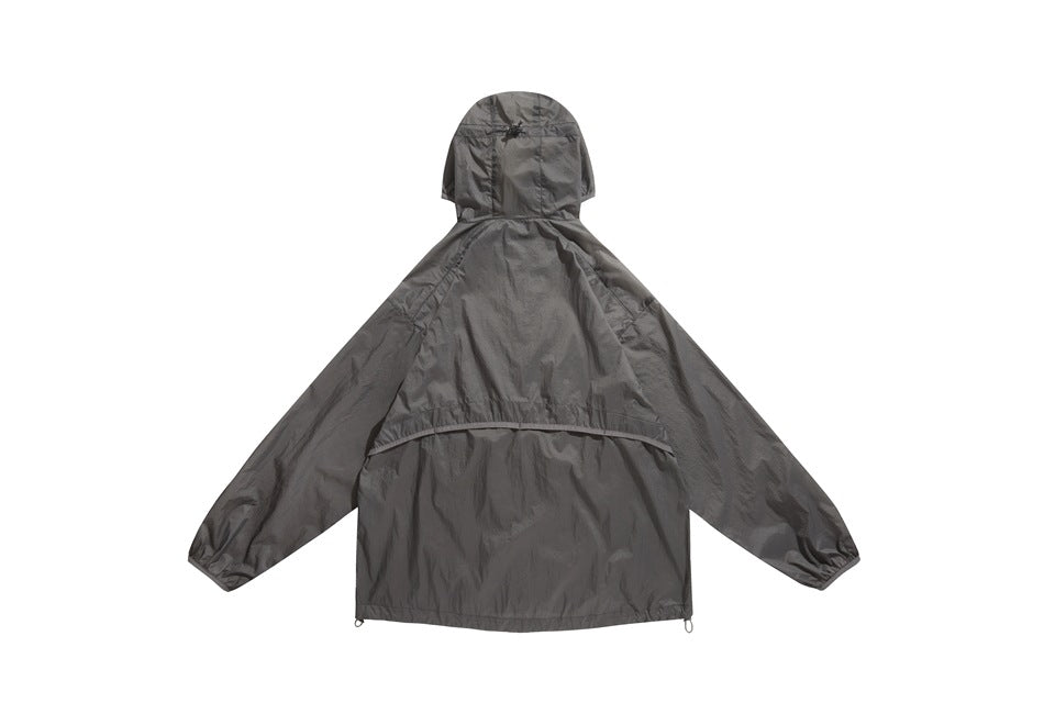 Back view of a charcoal gray hooded jacket with long sleeves, a curved back seam, and adjustable hem loops.