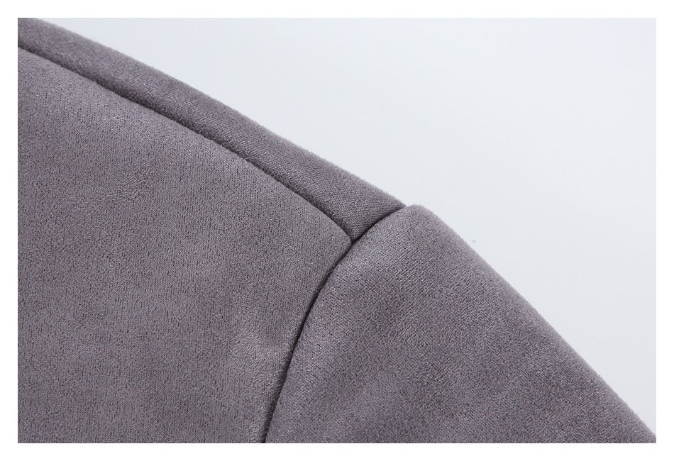 Close-up of a charcoal gray jacket's shoulder seam and sleeve.