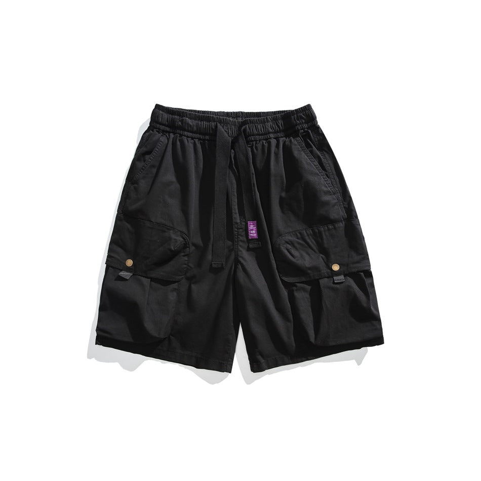 Black cargo shorts flat lay with elastic drawstring waist and large snap flap cargo pockets
