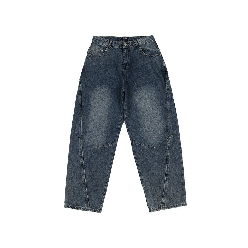 Front view of blue-gray washed denim jeans with faded thighs, five pockets, zip fly and curved leg seams