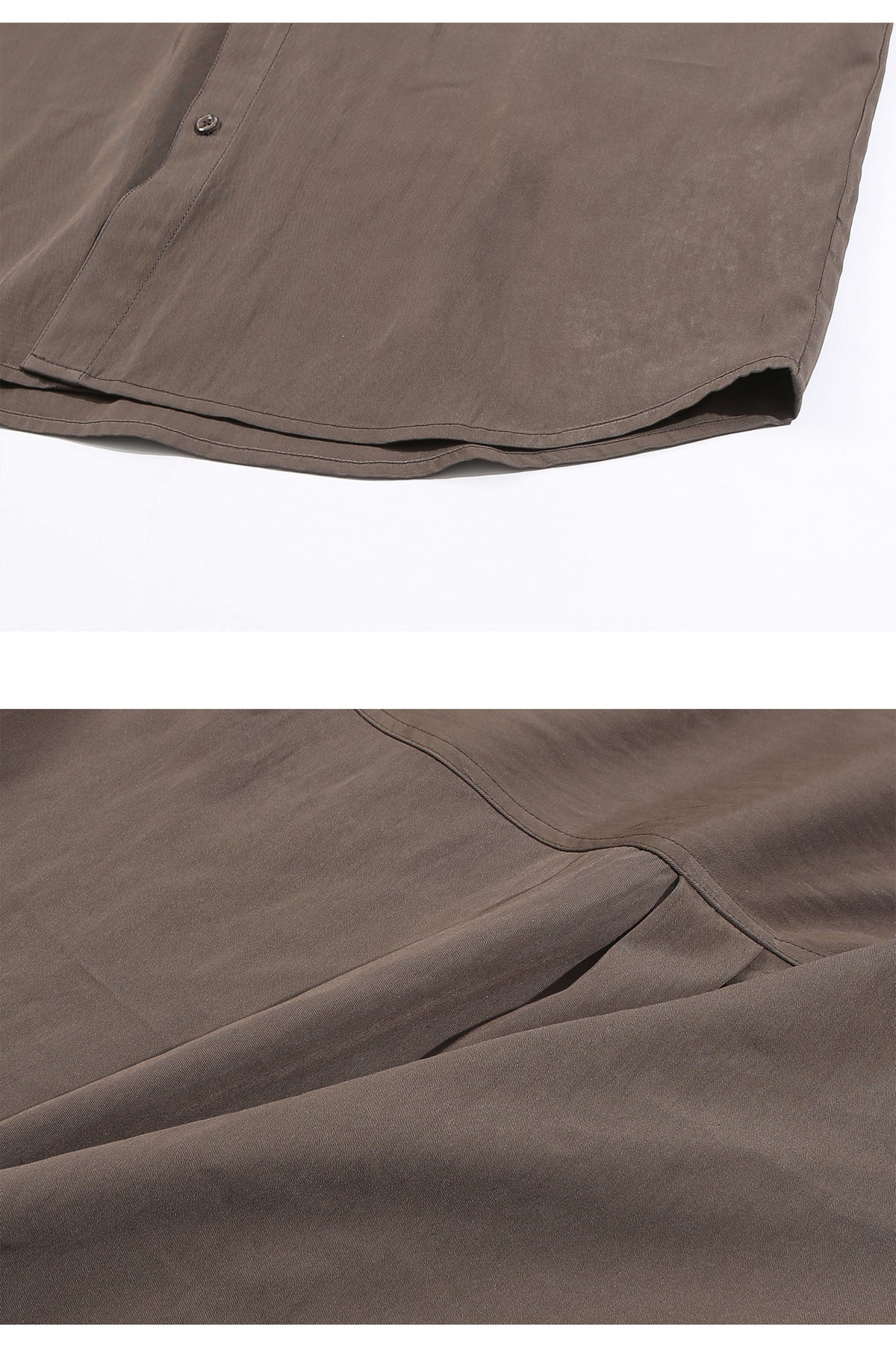 Close-up of the taupe-brown shirt's curved hem, stitching, and fabric texture.