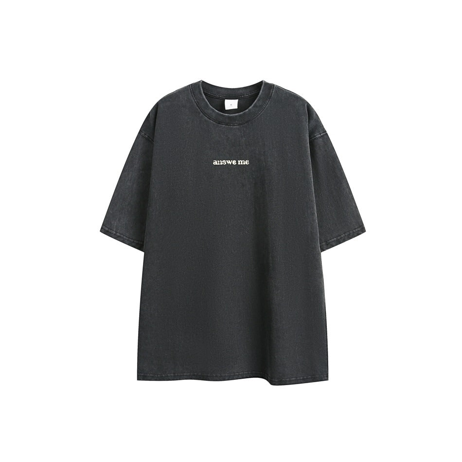 Black washed short-sleeve crew-neck t-shirt flat lay with small centered chest print