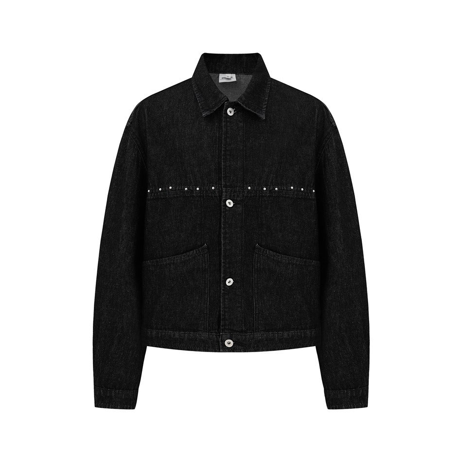 Black denim-style jacket front view with pointed collar, button front, studded chest line and two large pockets