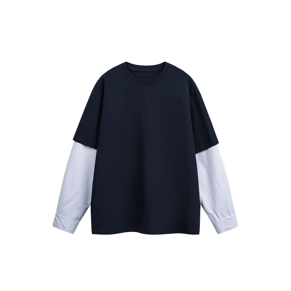 Navy crew-neck top with light blue pinstriped shirt-style layered sleeves, flat front view