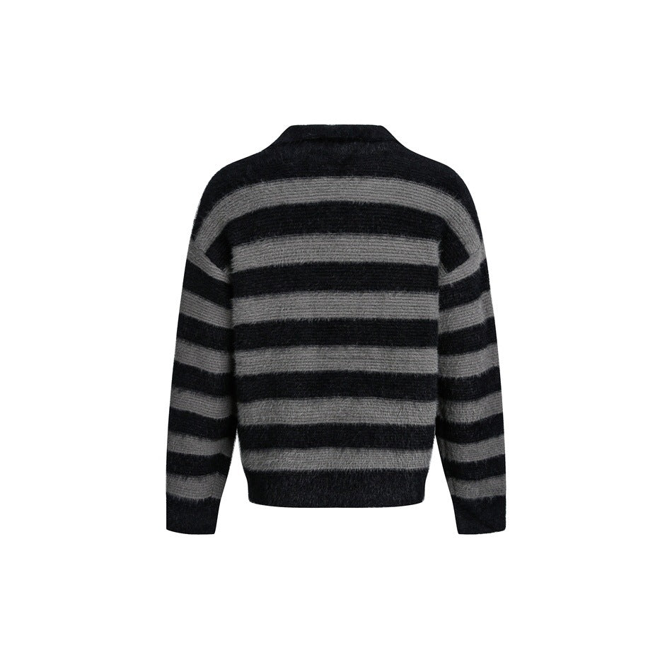 Back view of black and gray horizontally striped fuzzy knit sweater on white background