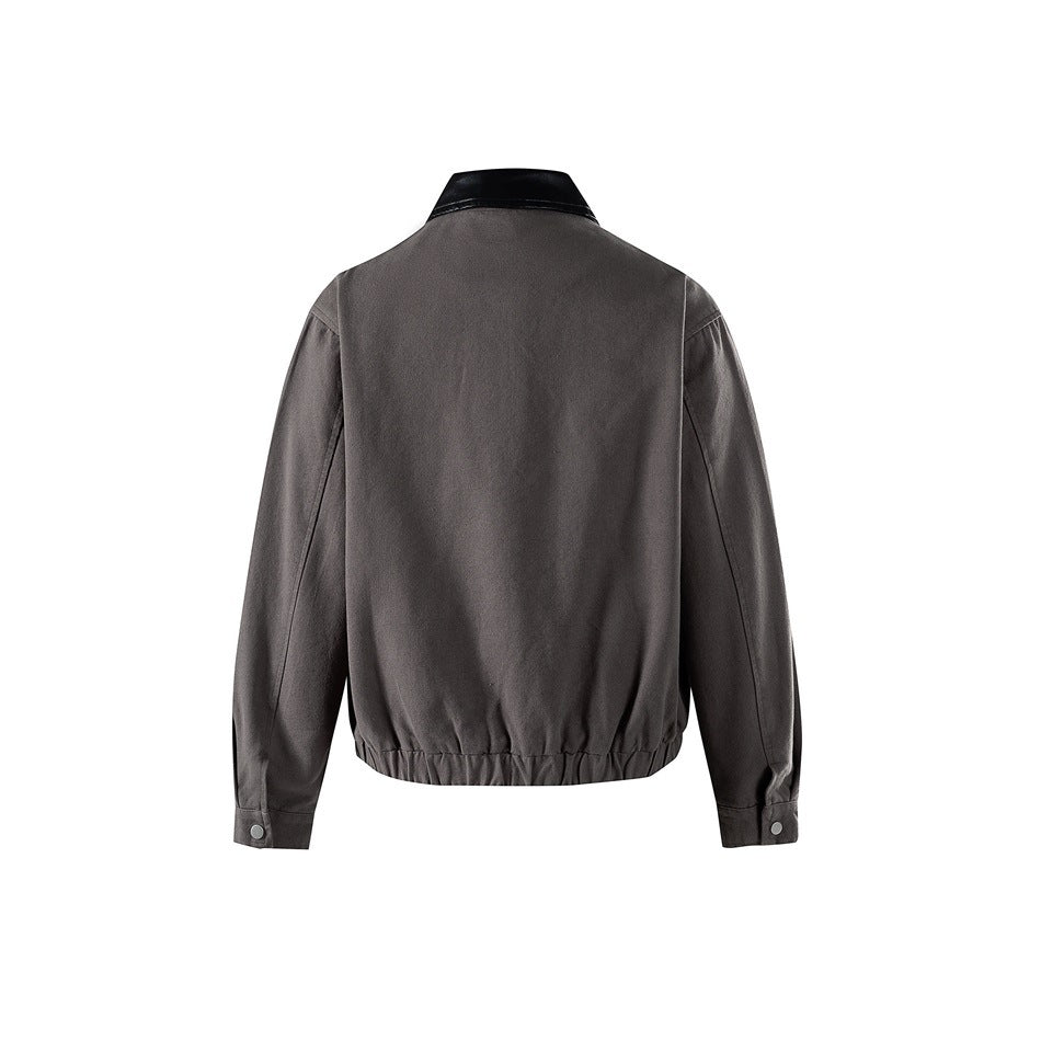 Back view of gray jacket with black collar, elastic gathered hem and snap-button cuffs