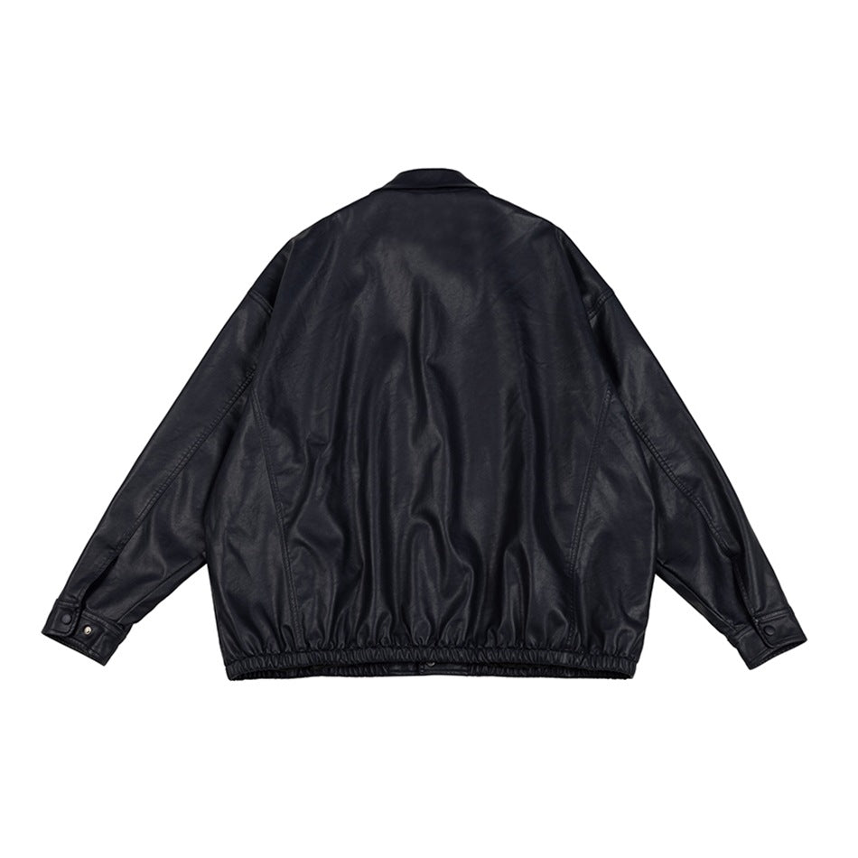 Back view of a black jacket with long sleeves, a plain back and an elasticated hem, shown flat.