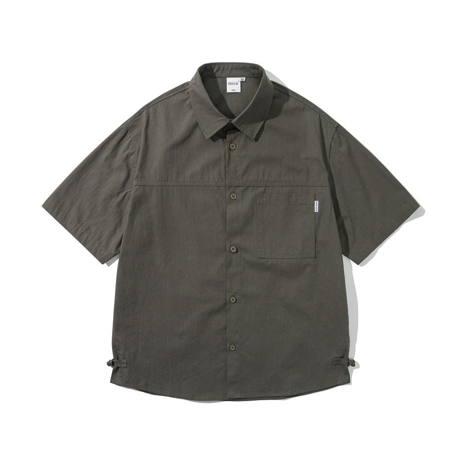 Olive-gray short-sleeve button-up shirt, front flat lay, chest pocket and knot-button side hem details