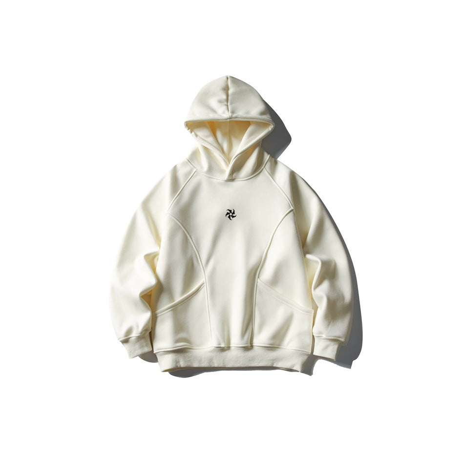 Cream beige hooded sweatshirt flat lay with curved seams, front pouch pockets and small black pinwheel logo