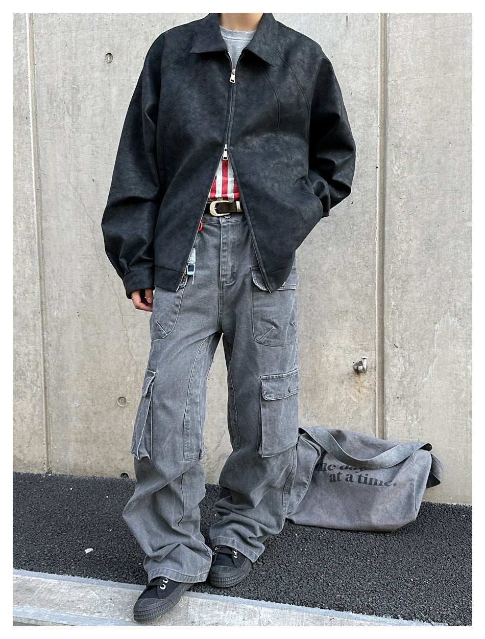Person wearing a charcoal zip-front jacket with a wide collar and gray cargo pants, shown from the front.