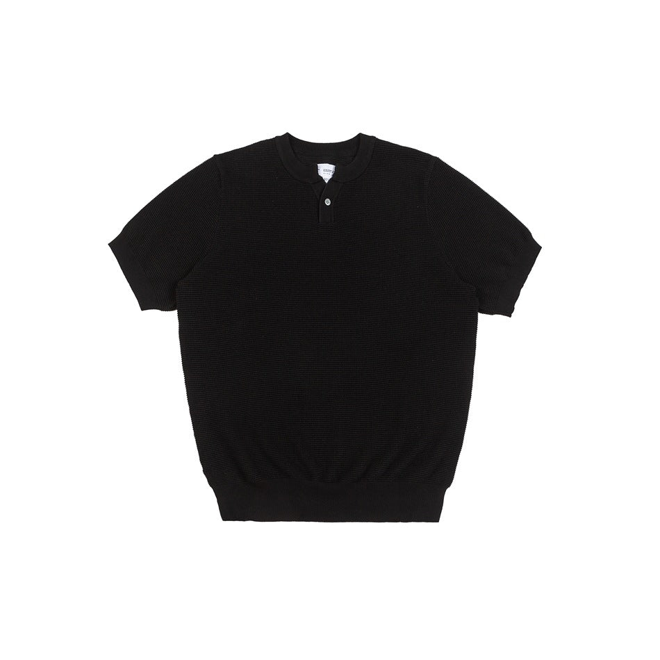 Black short-sleeve knit top with textured knit, round neck and two-button placket, flat front view