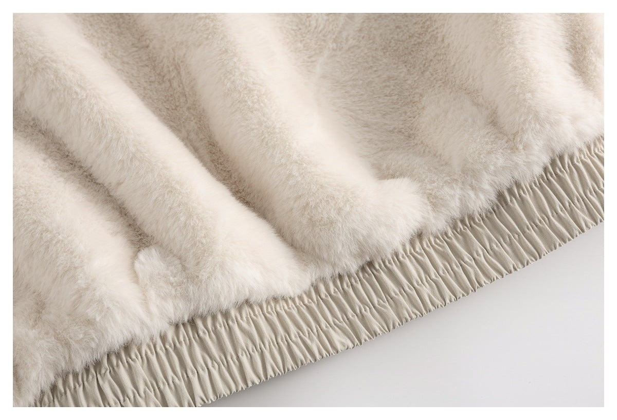 Close-up of plush light-colored lining beside a gathered elastic edge.