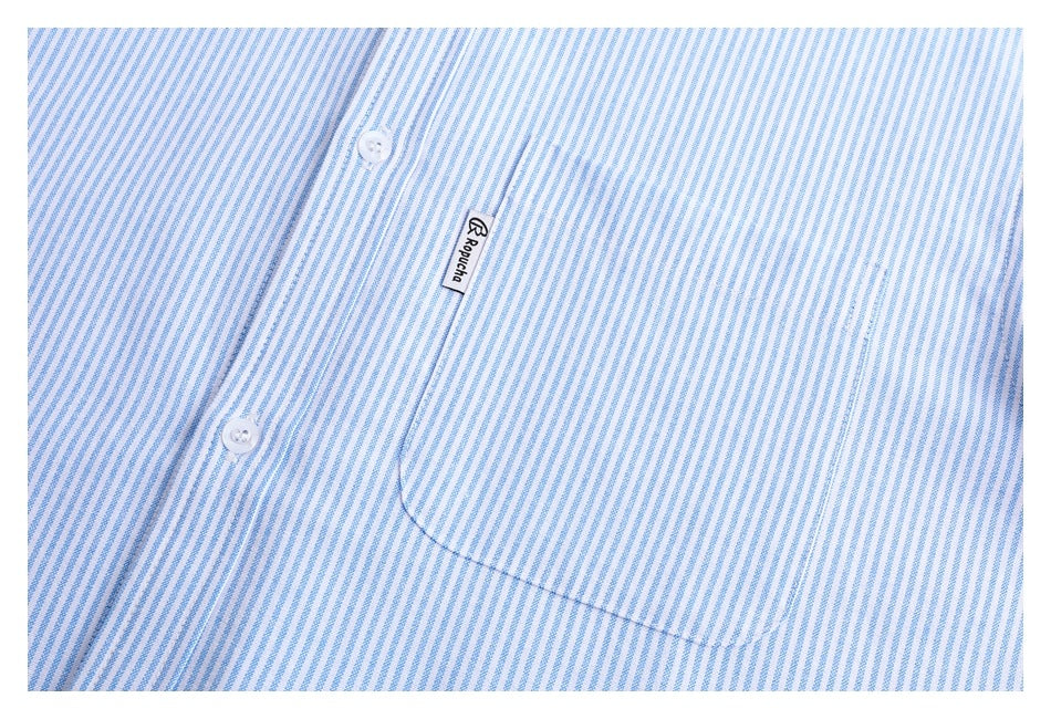 Close-up of a light blue and white striped shirt front with white buttons and a curved chest pocket.