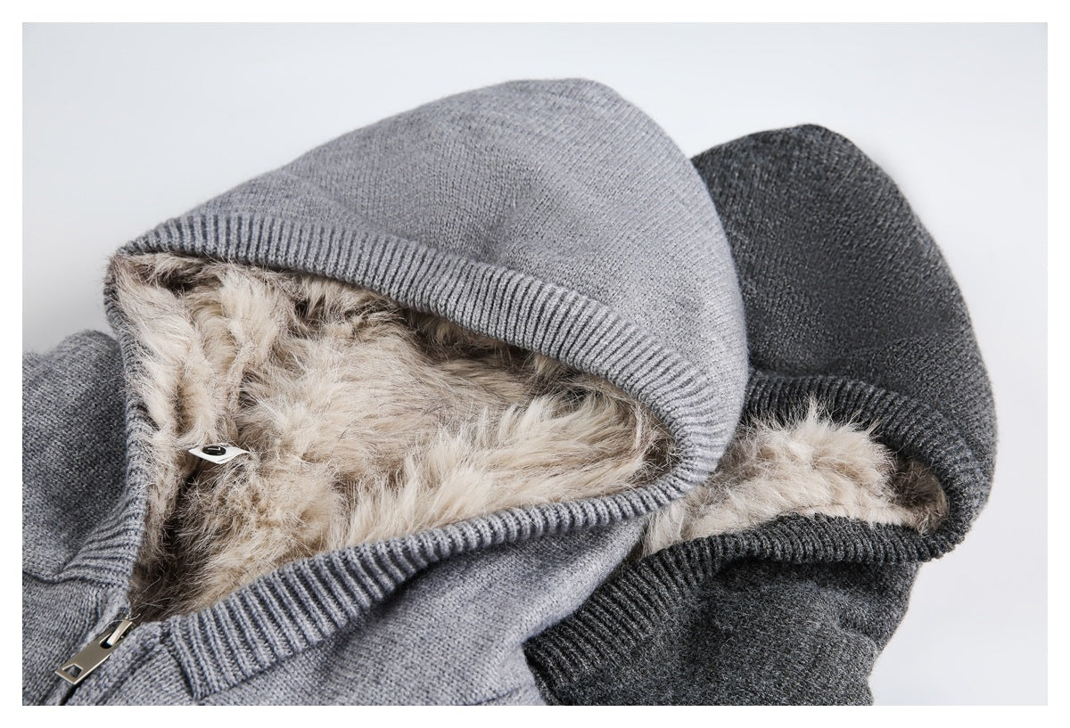 Close-up of light gray and charcoal zip-up hoodies showing ribbed hood edges and fluffy beige lining.