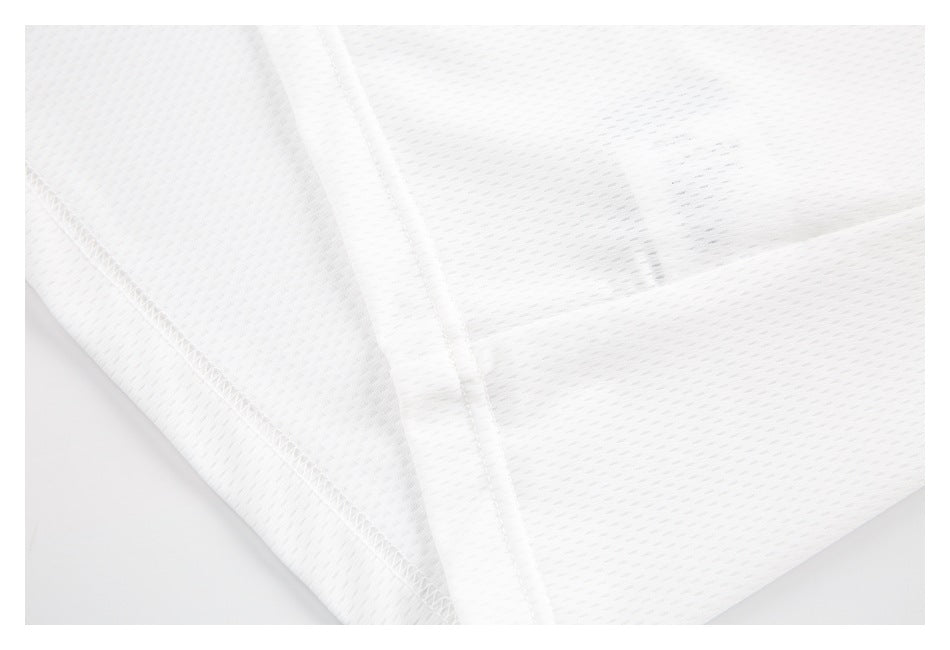 Close-up of white mesh garment fabric showing stitched seams and an overlapping panel.