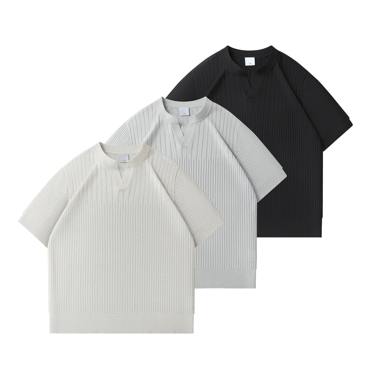 Three ribbed short-sleeve tops with split necklines, shown in cream, light gray, and black.