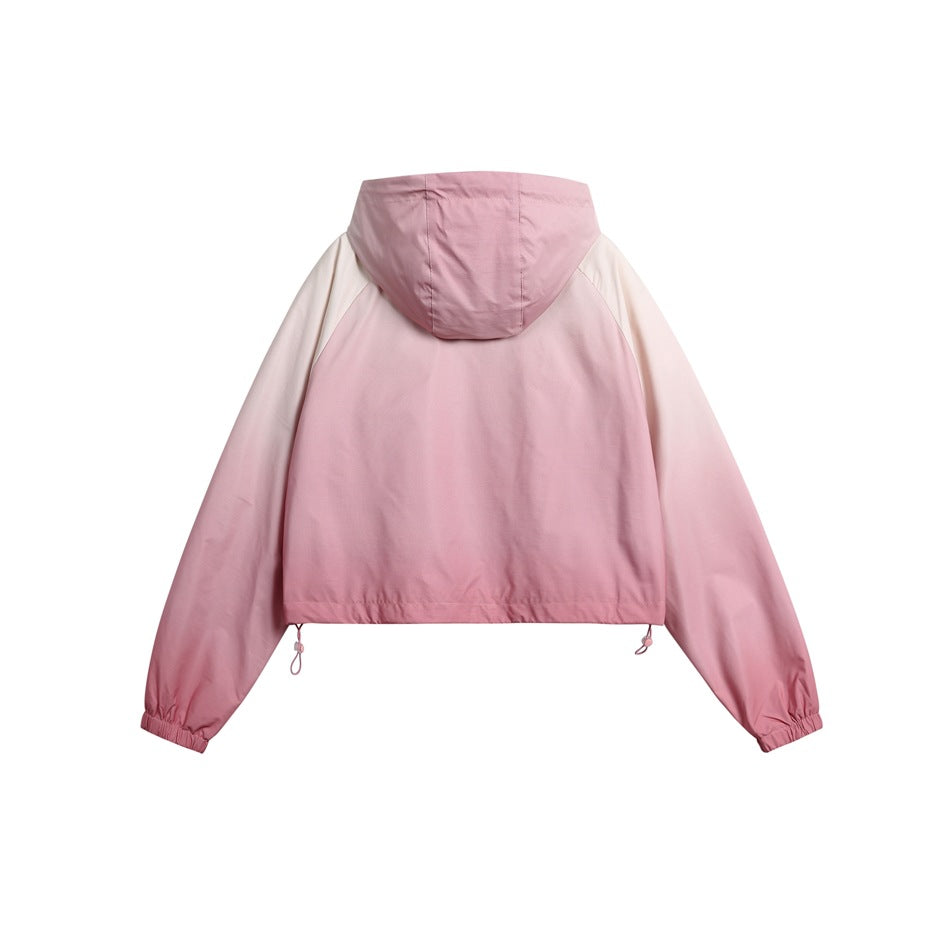 Back view of a cropped pink hooded jacket with a plain body and hood.