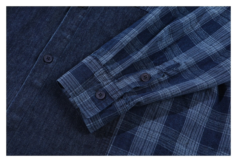 Close-up of a plaid shirt cuff with dark buttons against solid navy fabric.