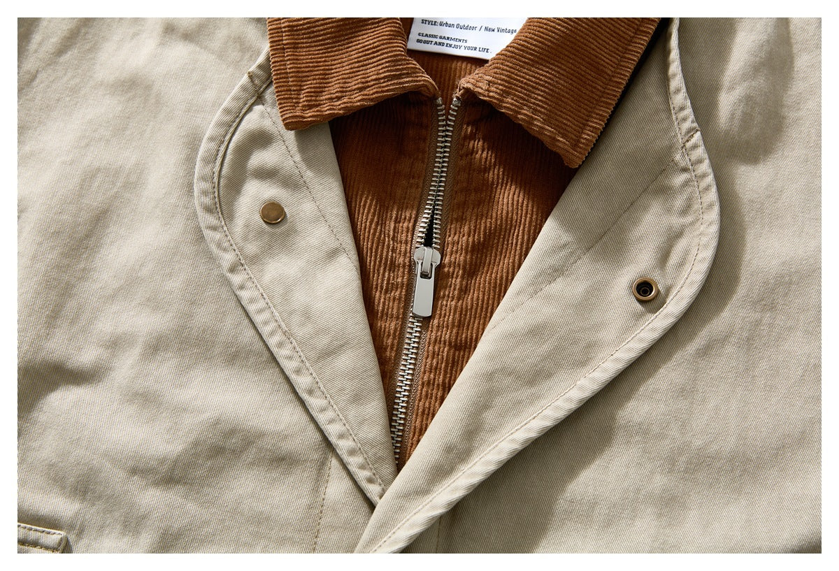 Close-up of the beige jacket’s brown corduroy inner panel, metal zipper, and snap-front placket.
