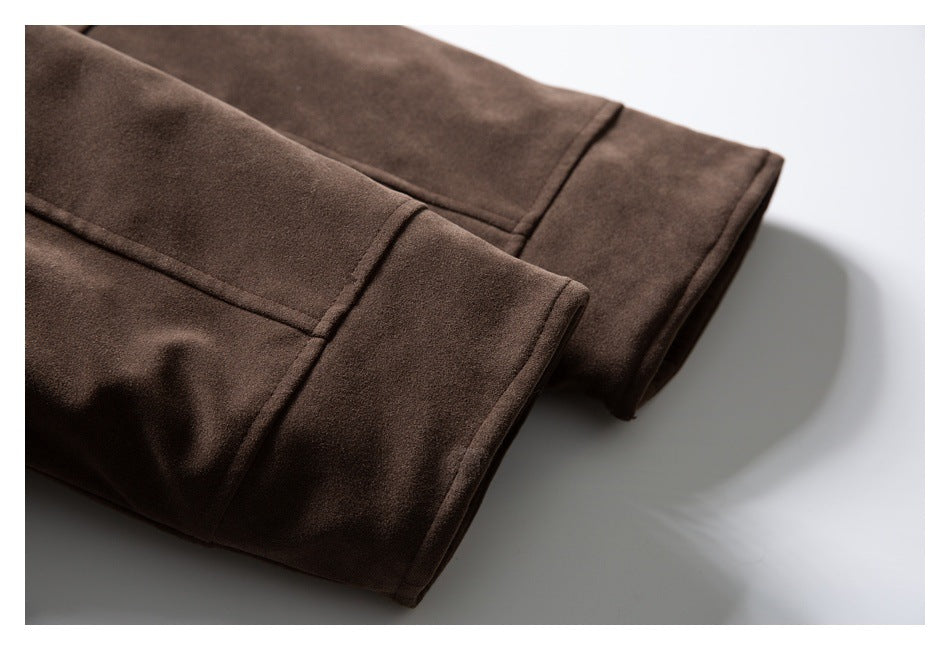 Close-up of the brown coat's stitched sleeve cuffs.
