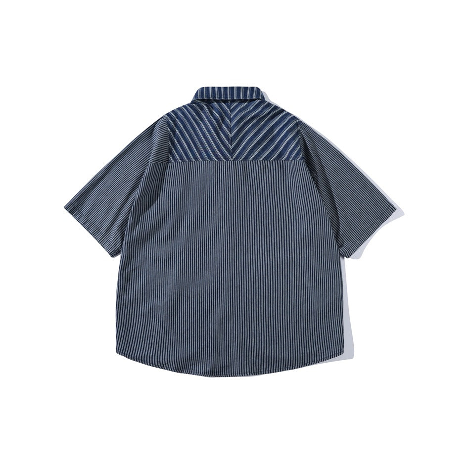 Back view of a blue striped short-sleeve shirt with a chevron-pattern striped yoke, flat lay